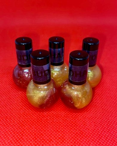 <transcy>Brillo de labios Smooth Kisses, Buddha Love, Amaretto, Angry Lillie</transcy>