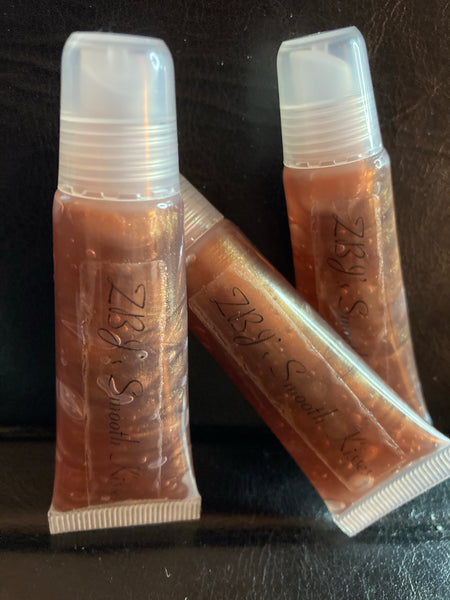 <transcy>Brillo de labios Smooth Kisses, Buddha Love, Amaretto, Angry Lillie</transcy>